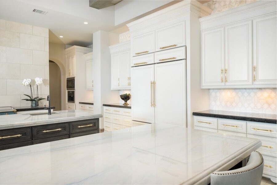 A kitchen space illuminated by professional lighting design.