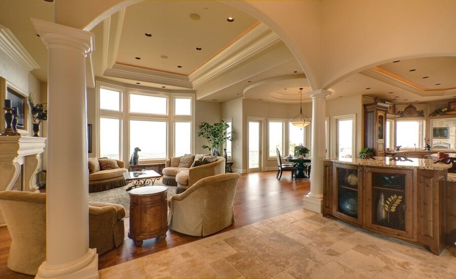 An open living space featuring in-ceiling, whole-home audio speakers.