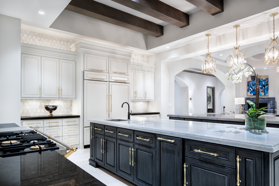 A kitchen space illuminated by Lutron lighting control fixtures.